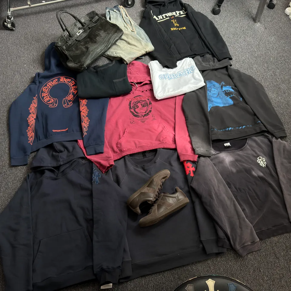 Hoodies, tops, a bag and brown sneakers laid out in the original 15kg Australia Reddit haul photo
